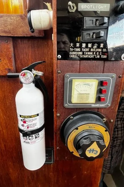Slide: The Image of Control panel with fire extinguisher on 1978 Custom Fantasia C/C Double Ended Cutter yacht. - 19