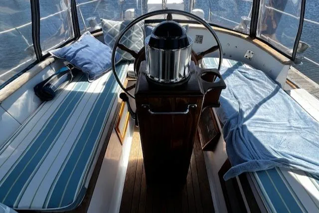 Slide: The Image of Interior of 1978 Custom Fantasia C/C Double Ended Cutter with striped seating and steering wheel. - 26