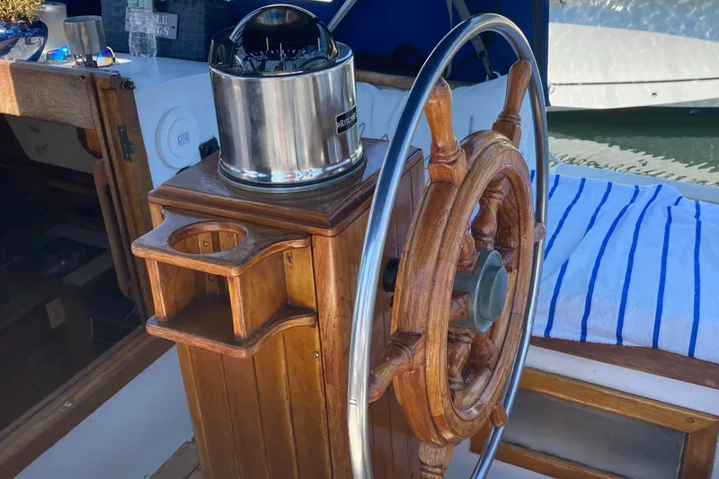 Slide: The Image of Wooden ship wheel and helm on 1978 Custom Fantasia C/C Double Ended Cutter. - 27