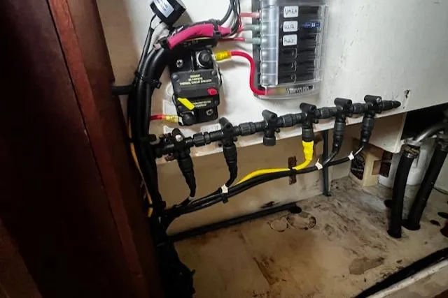 Slide: The Image of Electrical wiring and fuse panel inside a 1978 Custom Fantasia C/C Double Ended Cutter. - 28