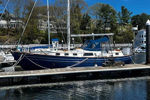 Slide: The Image of 1978 Custom Fantasia C/C Double Ended Cutter docked at a marina. - 32