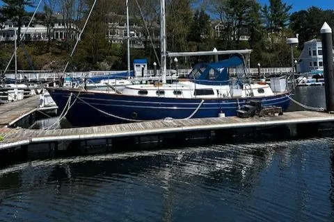 Slide: The Image of A 1978 Custom Fantasia C/C Double Ended Cutter docked at a marina. - 33