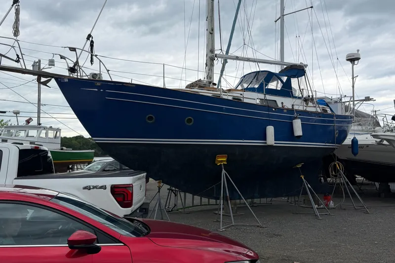 Slide: The Image of Blue 1978 Custom Fantasia C/C Double Ended Cutter sailboat on stands in a boatyard. - 34