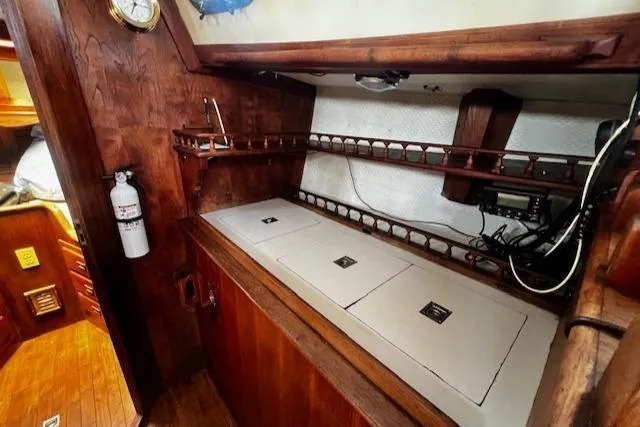 Slide: The Image of 1978 Custom Fantasia C/C Double Ended Cutter interior with wooden cabinetry and storage compartments. - 7
