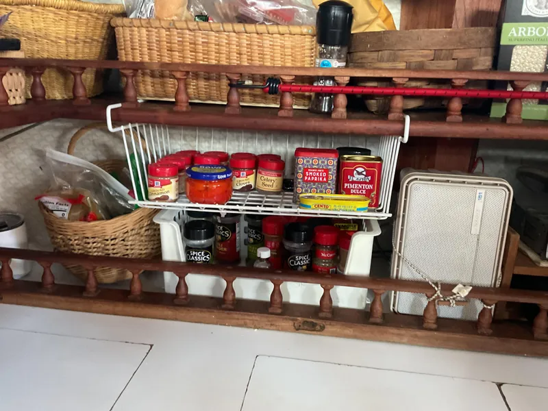 Slide: The Image of Kitchen shelf with spices, baskets, and a vintage 1978 Fantasia C/C Double Ended Cutter. - 8