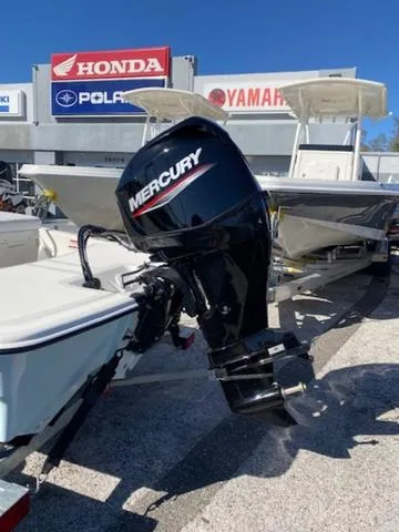 Slide: The Image of 2025 Mako Pro Skiff 15 CC with Mercury outboard motor at dealership. - 8