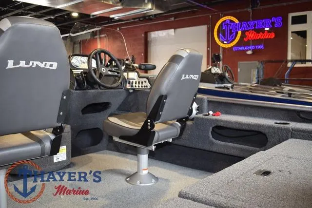 Slide: The Image of 2022 Lund 1675 Adventure Sport boat interior at Thayer's Marine showroom. - 11