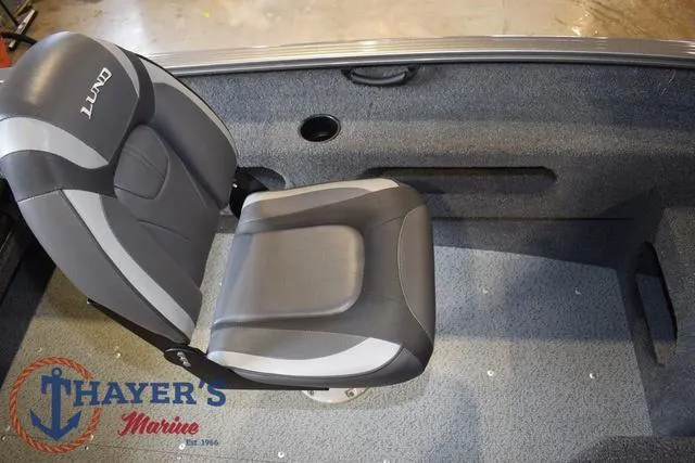 Slide: The Image of 2022 Lund 1675 Adventure Sport boat seat, gray and black, Thayer's Marine logo visible. - 17