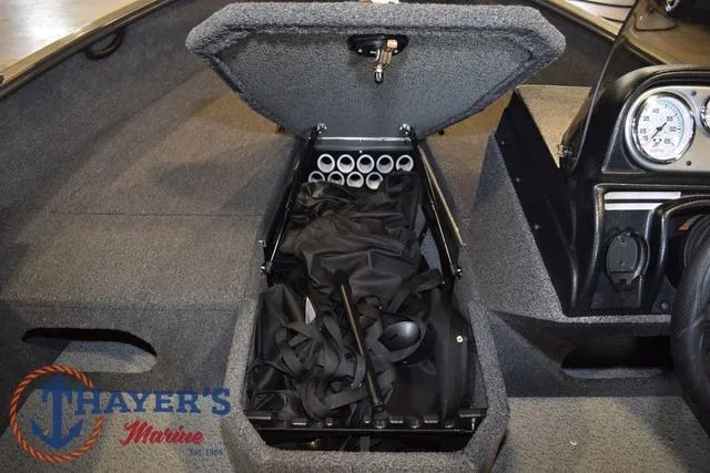 Slide: The Image of 2022 Lund 1675 Adventure Sport boat interior with open storage compartment. - 26