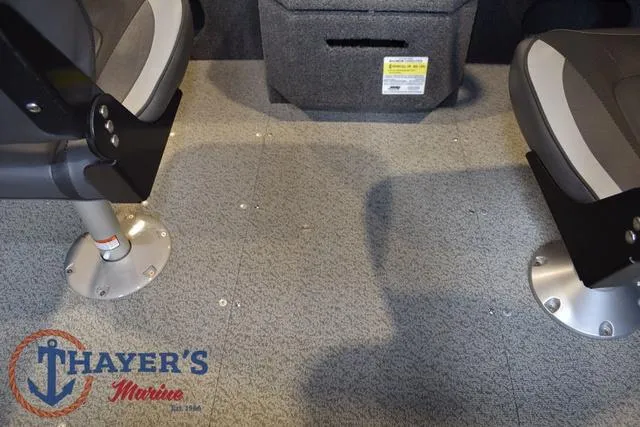 Slide: The Image of Interior of 2022 Lund 1675 Adventure Sport boat with seating and Thayer's Marine logo. - 29