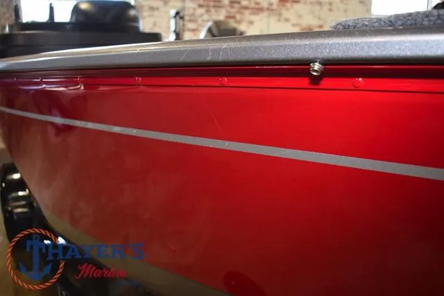 Slide: The Image of 2022 Lund 1675 Adventure Sport boat, red exterior, close-up view. - 35