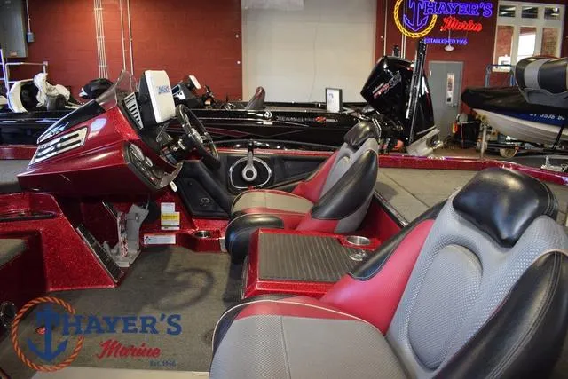 Slide: The Image of 2017 Ranger Z521C boat interior with red and gray seating at Thayer's Marine showroom. - 10