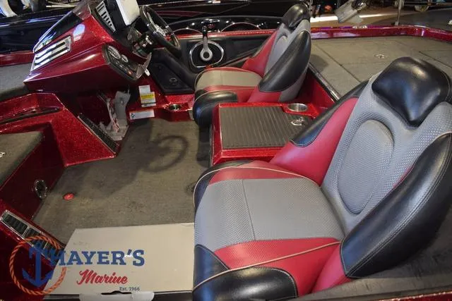 Slide: The Image of 2017 Ranger Z521C boat interior with red and gray seats, Mayer's Marine logo. - 11