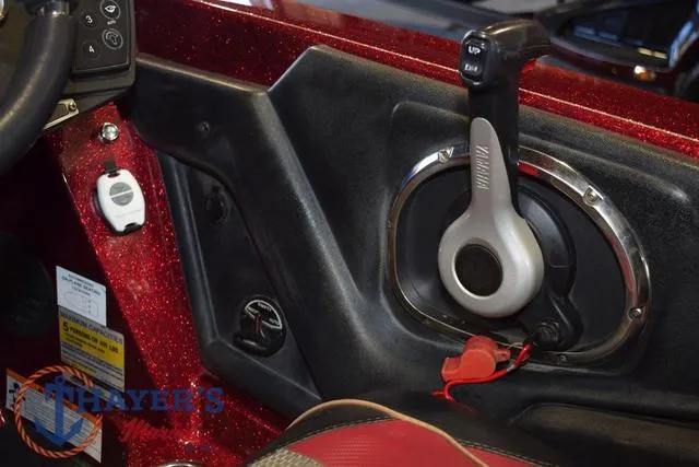 Slide: The Image of 2017 Ranger Z521C boat control panel with throttle lever and red metallic finish. - 23