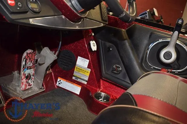 Slide: The Image of 2017 Ranger Z521C boat interior with red accents and control panel. - 24