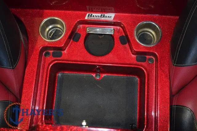 Slide: The Image of 2017 Ranger Z521C boat interior with cup holders and storage compartment. - 28