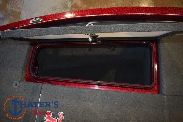 Slide: The Image of Open storage compartment in 2017 Ranger Z521C boat with carpeted interior. - 29