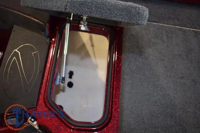 Slide: The Image of 2017 Ranger Z521C boat storage compartment with open lid and hydraulic lift. - 31
