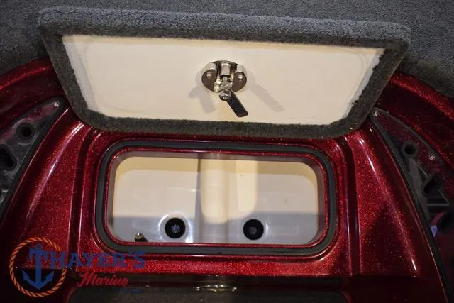 Slide: The Image of 2017 Ranger Z521C boat storage compartment with lock, featuring Thayer's Marine logo. - 33