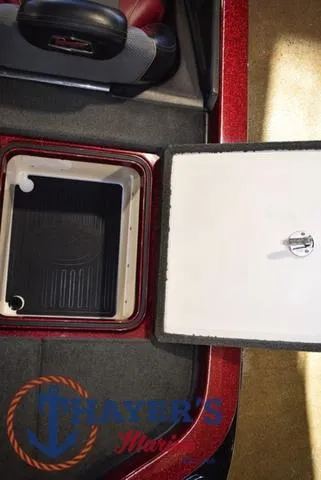 Slide: The Image of 2017 Ranger Z521C boat storage compartment with open lid, featuring a black interior. - 38