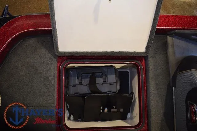 Slide: The Image of 2017 Ranger Z521C storage compartment with tackle box, carpeted interior, and Thayer's Marine logo. - 39