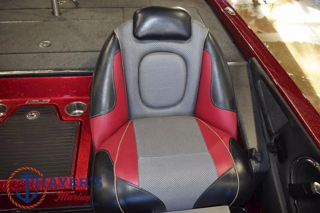 Slide: The Image of 2017 Ranger Z521C boat seat with red, gray, and black upholstery. - 43