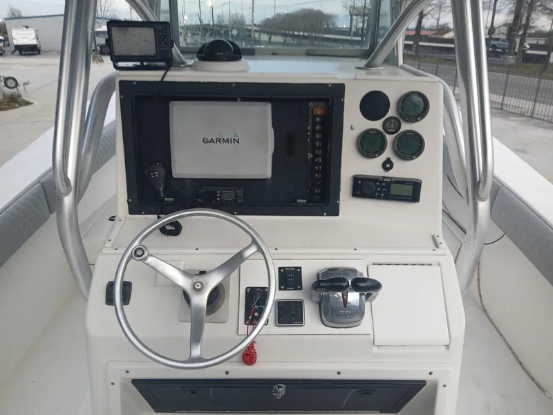Slide: The Image of 2001 Regulator 32 boat console with Garmin navigation and control instruments. - 10