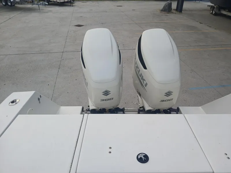 Slide: The Image of Twin Suzuki 300 outboard engines on a 2001 Regulator 32 boat. - 12