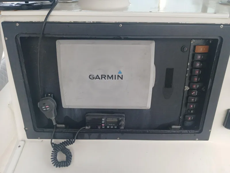Slide: The Image of Garmin marine electronics on 2001 Regulator 32 boat dashboard. - 3