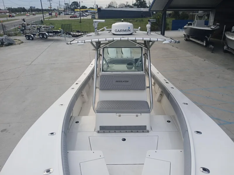 Slide: The Image of 2001 Regulator 32 boat with Garmin equipment, docked at a marina. - 5