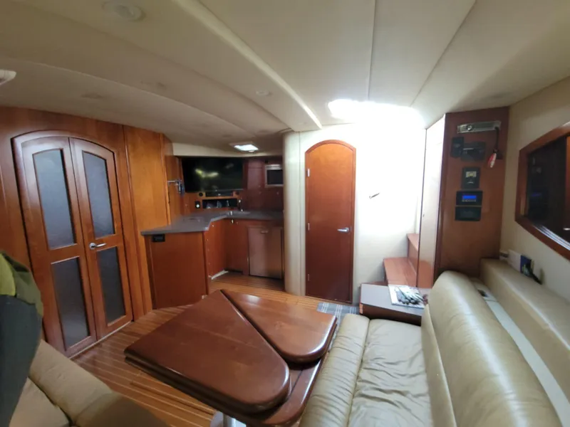 Slide: The Image of Interior of 2011 Rampage 41 Express yacht with wood finishes and modern amenities. - 13