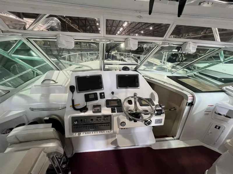 Slide: The Image of Helm of 2011 Rampage 41 Express boat with modern navigation equipment. - 7