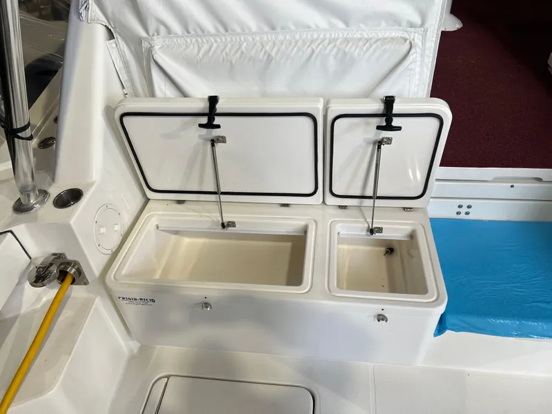 Slide: The Image of 2011 Rampage 41 Express boat with open storage compartments on deck. - 8