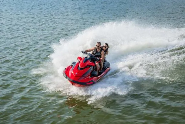Slide: The Image of 2025 Yamaha Waverunner VX speeding on water with two riders. - 16
