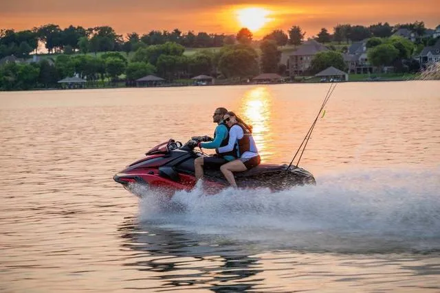Slide: The Image of 2025 Yamaha Waverunner VX on a lake at sunset, two riders enjoying a scenic ride. - 18