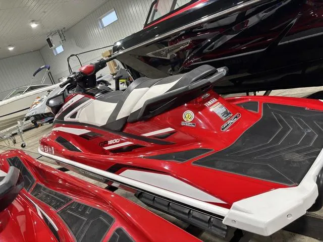 Slide: The Image of 2018 Yamaha Waverunner GP1800 in a showroom, red and white design. - 3