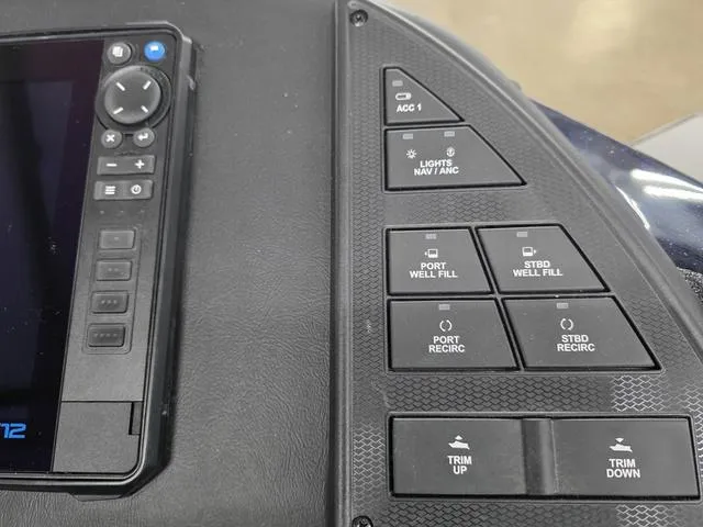 Slide: The Image of Control panel of a 2025 Caymas CX21 Pro boat with various function buttons. - 13