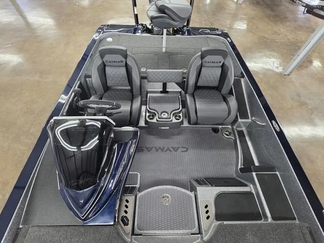 Slide: The Image of 2025 Caymas CX21 Pro boat interior with dual seats and steering console. - 17