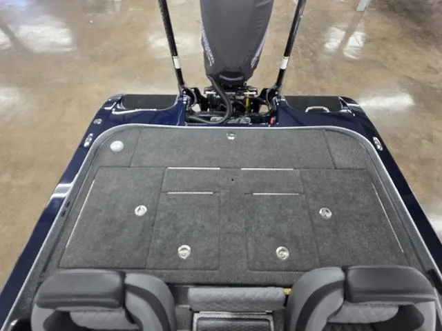 Slide: The Image of 2025 Caymas CX21 Pro boat interior with carpeted deck and seating. - 19