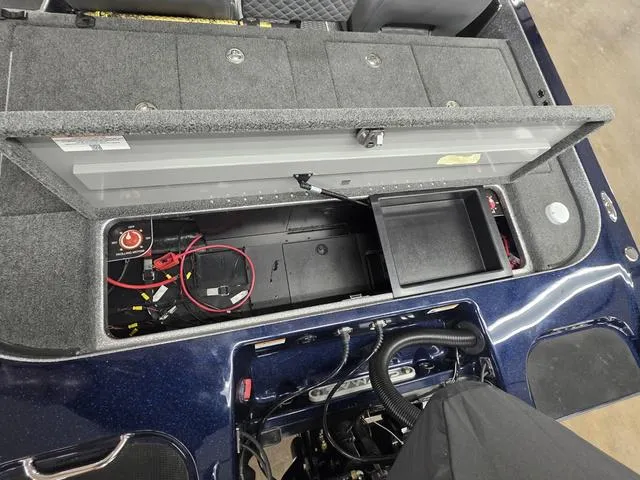 Slide: The Image of 2025 Caymas CX21 Pro boat storage compartment with wiring and battery setup. - 22