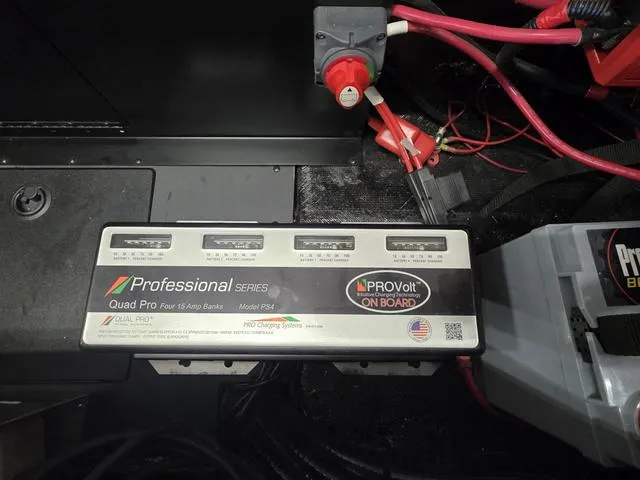 Slide: The Image of Onboard battery charger in a 2025 Caymas CX21 Pro boat. - 23