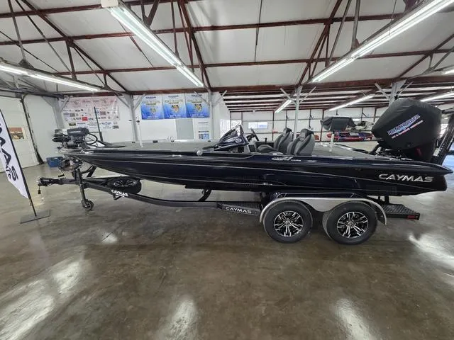 Slide: The Image of 2025 Caymas CX21 Pro boat displayed indoors on a trailer. - 3
