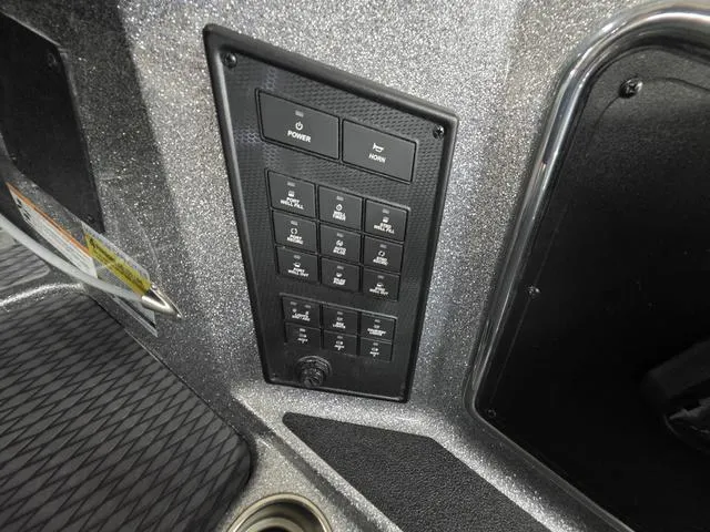 Slide: The Image of Control panel of 2025 Caymas CX21 Pro boat with multiple switches and buttons. - 30