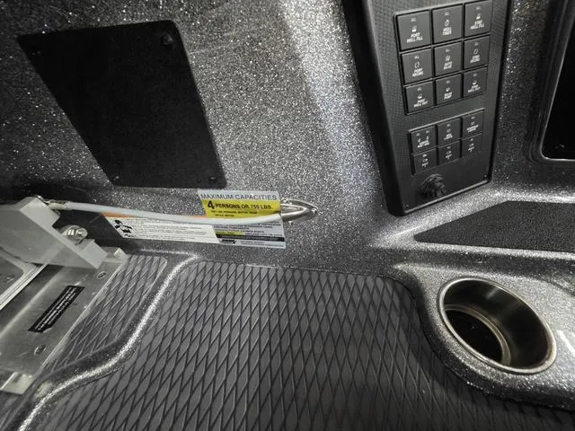 Slide: The Image of 2025 Caymas CX21 Pro interior dashboard with control panel and cup holder. - 31