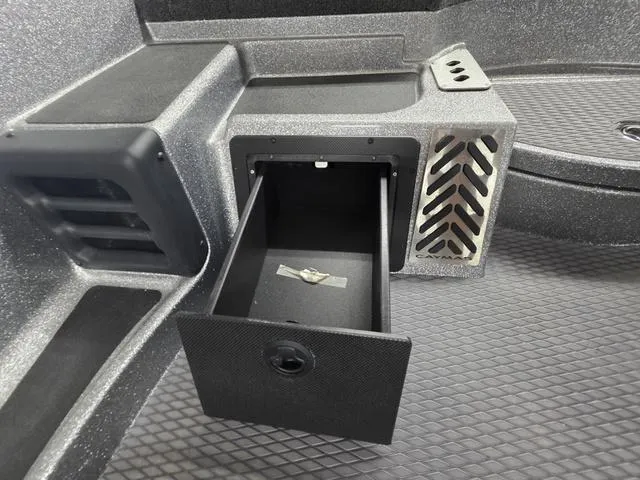 Slide: The Image of 2025 Caymas CX21 Pro boat storage compartment with open drawer, showcasing interior design. - 35