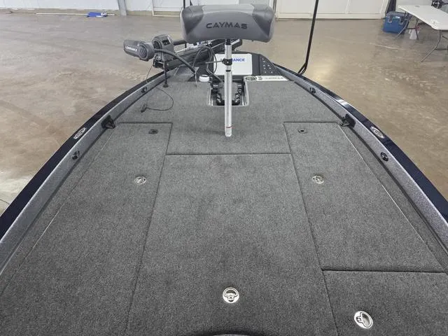 Slide: The Image of 2025 Caymas CX21 Pro boat deck with trolling motor in a showroom. - 42