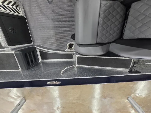 Slide: The Image of Interior of 2025 Caymas CX21 Pro boat with quilted seats and storage compartments. - 43