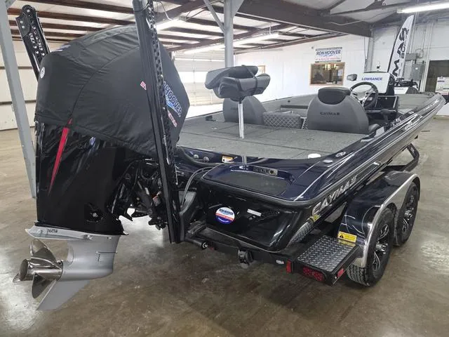 Slide: The Image of 2025 Caymas CX21 Pro boat in showroom, featuring sleek design and powerful engine. - 5