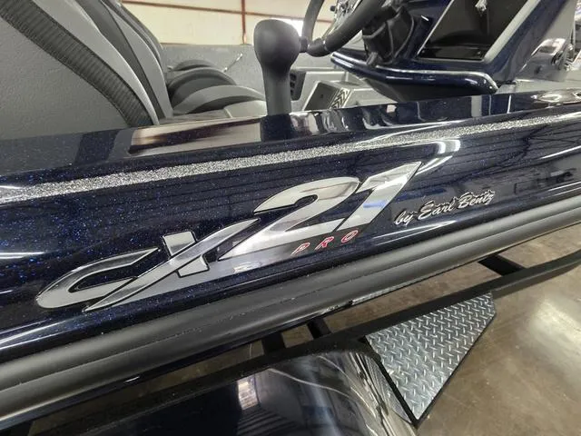 Slide: The Image of 2025 Caymas CX21 Pro boat detail, featuring sleek design and branding by Earl Bentz. - 7
