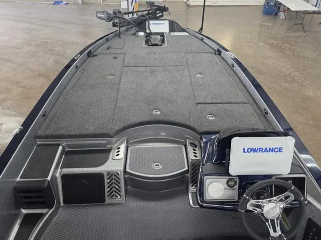 Slide: The Image of 2025 Caymas CX21 Pro boat interior with Lowrance electronics and spacious deck. - 9